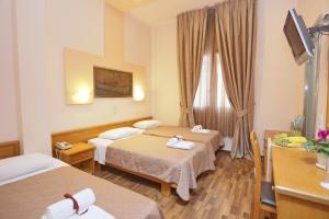 Voodi või voodid majutusasutuse Aegeon Hotel toas