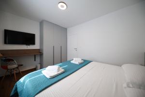Postel nebo postele na pokoji v ubytování Apartmani Diklo