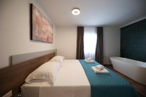 Postel nebo postele na pokoji v ubytování Apartmani Diklo