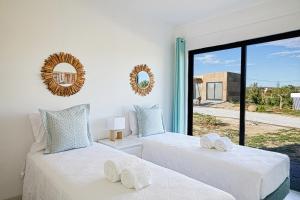 Ένα ή περισσότερα κρεβάτια σε δωμάτιο στο EcoVillas Escudeira +75 φωτογραφίες