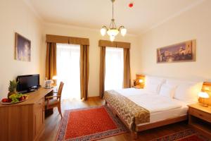 Postel nebo postele na pokoji v ubytování Hotel Historia & Historante