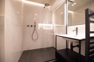 a bathroom with a shower and a sink at MBM - Luxury home in marais in Paris