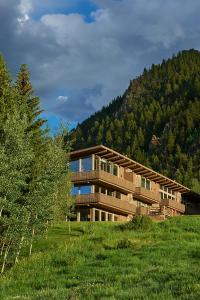 a large building in the middle of a grass field at Deluxe Two Bedroom - Aspen Alps #707 in Aspen