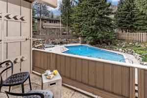 a backyard with a swimming pool on a fence at Standard Two Bedroom - Aspen Alps #103 in Aspen