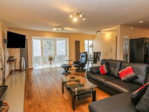 a living room with a couch and a table at Mead House in Darlington