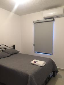 Postel nebo postele na pokoji v ubytování Suites Cervantes