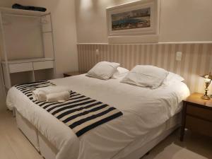 Cama o camas de una habitación en Residencial Portal da Barra