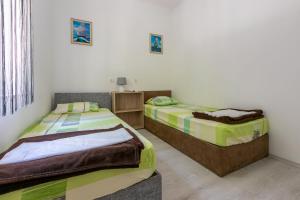 Posteľ alebo postele v izbe v ubytovaní Apartment DANIJEL
