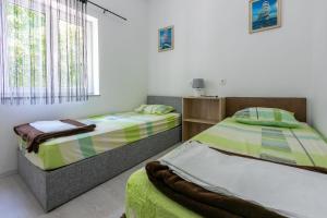 Posteľ alebo postele v izbe v ubytovaní Apartment DANIJEL