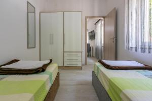 Posteľ alebo postele v izbe v ubytovaní Apartment DANIJEL