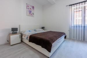 Posteľ alebo postele v izbe v ubytovaní Apartment DANIJEL