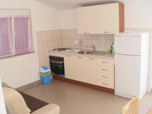 Kuchyň nebo kuchyňský kout v ubytování Apartments GUNJA