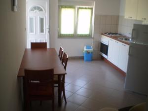 Kuchyň nebo kuchyňský kout v ubytování Apartments GUNJA + 22 fotografií
