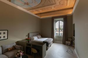 Posteľ alebo postele v izbe v ubytovaní Domus 21 Luxury Suites
