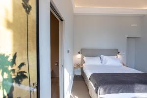 Posteľ alebo postele v izbe v ubytovaní Domus 21 Luxury Suites