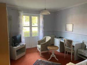 TV a/nebo společenská místnost v ubytování Xundheits Hotel Garni Eckershof