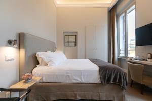 Posteľ alebo postele v izbe v ubytovaní Domus 21 Luxury Suites