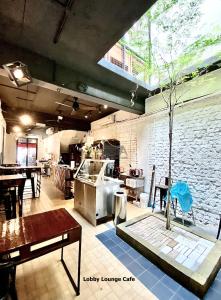 a large room with a kitchen and a table at Kim Haus Loft in George Town