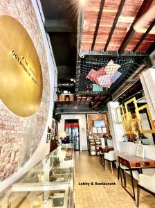 a restaurant with a glass counter in a room at Kim Haus Loft in George Town