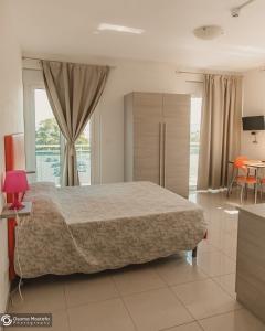 Ένα ή περισσότερα κρεβάτια σε δωμάτιο στο Residence Le Stelle