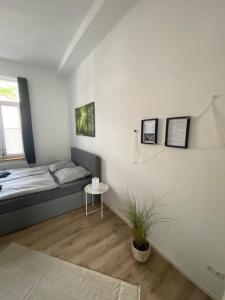 Ένα ή περισσότερα κρεβάτια σε δωμάτιο στο FeWo Möwe