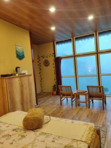 Ένα ή περισσότερα κρεβάτια σε δωμάτιο στο Chamba Nest