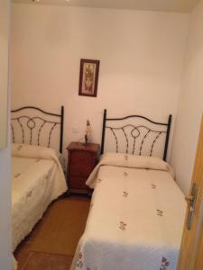 Postel nebo postele na pokoji v ubytování Casa Rural el Maestro II