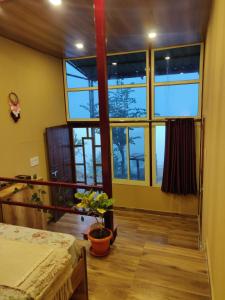 Ένα ή περισσότερα κρεβάτια σε δωμάτιο στο Chamba Nest