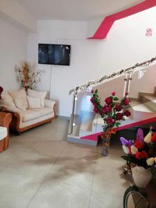 a living room with a couch and a mirror at Casa Regala EAR in Craiova