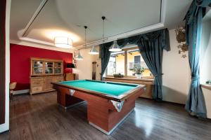 a room with a pool table in it at Sport Hotel S. Vigilio in Moena
