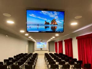 a conference room with a large screen on the ceiling at Monastero San Vincenzo - Casa Per Ferie in Bassano Romano
