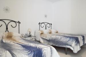 Postel nebo postele na pokoji v ubytování Tango House