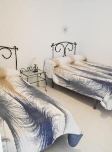 Postel nebo postele na pokoji v ubytování Tango House