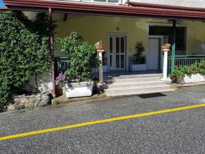 a house with stairs and plants in front of it at Top bedroom GOLFO - Le Lincelle, Lamezia - 2 extra large single beds in SantʼEufemia Lamezia