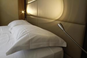 Uma cama ou camas num quarto em Santa Caterina Resort