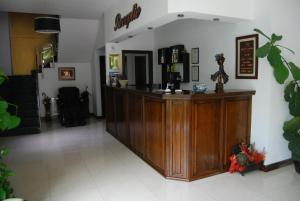 a lobby with a bar in the middle of a room at Hotel Zodiac in Constanţa