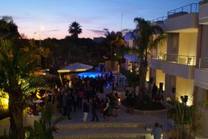 a group of people standing outside of a building at Santa Caterina Resort in Santa Caterina di Nardò +37 photos