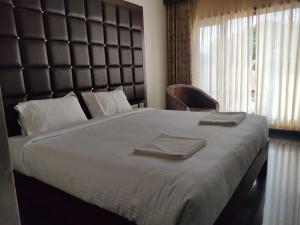 Postel nebo postele na pokoji v ubytování HOTEL VIJAYARANI