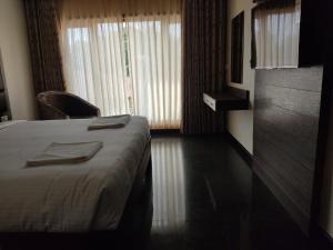 Postel nebo postele na pokoji v ubytování HOTEL VIJAYARANI