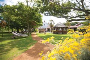 a house that has a garden in it at The Farmhouse Hotel and Restaurant in St Saviour Guernsey