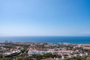 an aerial view of a city and the ocean at Luxury Villa Maria private heated pool Free Car except Christmas in Adeje +40 photos