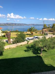 a view of the ocean from a house at Aloni Studios and Apartments in Lassi