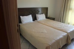 Кровать или кровати в номере Hotel Yassmina
