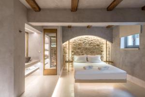 Posteľ alebo postele v izbe v ubytovaní Inotropes Boutique Suites - Adults Only