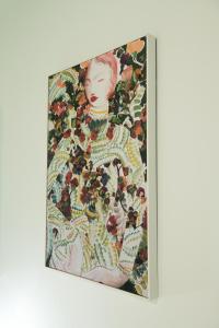 a painting of a woman with fruits and vegetables at The Blue apartment in the heart of Heraklion in Heraklio