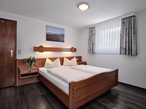 
Ein Bett oder Betten in einem Zimmer der Unterkunft Parkhotel Waldeck Titisee
