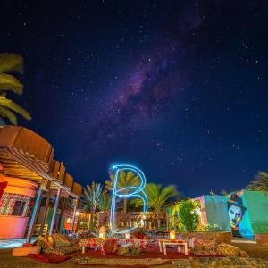 a night view of a theme park with the milky way at Bishbishi Camp Dahab in Dahab