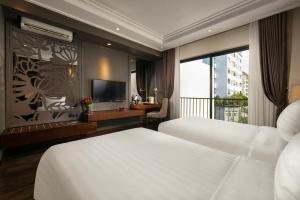 Postel nebo postele na pokoji v ubytování Ping Diamond Hotel Hanoi + 20 fotografií