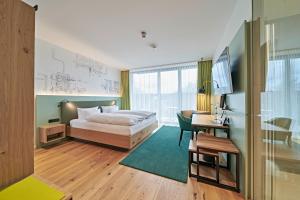 Postel nebo postele na pokoji v ubytování Hotel Federwerk + 24 fotografií