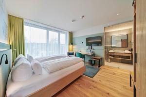 Postel nebo postele na pokoji v ubytování Hotel Federwerk